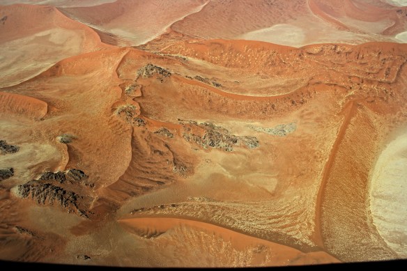 Strange formations of coloured sand and rock in the Namib Desert are only visible from the air