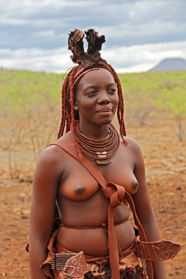 Young Himba woman in traditional dress in Kunene, Namibia