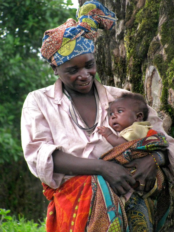 Batwa mother and baby in Mgahinga Gorilla National Park, Uganda